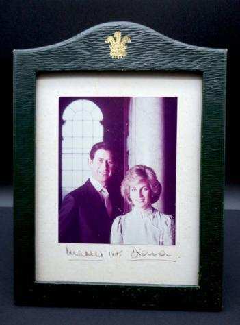 Charles and Diana, Photo originally signed in fountain pen by the Royal Family in the original frame - 1985