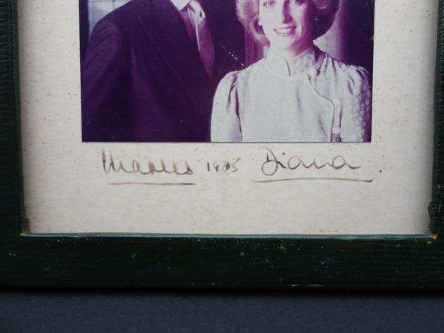 Charles and Diana, Photo originally signed in fountain pen by the Royal Family in the original frame - 1985