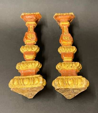Coppia di antichi candelieri in legno intagliato sec. XVIII