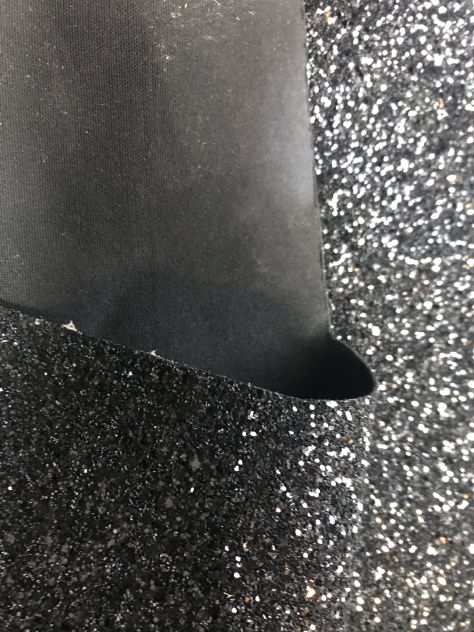 Scampolo tessuto nero glitterato da pelletteria
