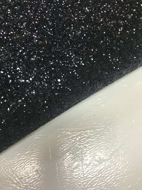 Scampolo tessuto nero glitterato da pelletteria
